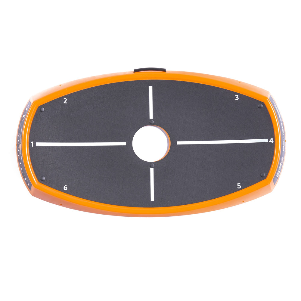 Top view orange and black golf power and balance deck with orange whip branding. Has an oval-shaped black and orange target plate with white crosshairs and numbered markings from 1 to 6, shown against a plain white background.